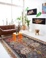 Vintage kilim rug in room decor setting, old rug, antique rug, pastel colors, faded colors, Turkish rug, vintage rug, soft rug, Portland, Oregon, rug store, rug shop, local shop, bold colors, bright colors, faded colors