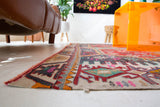 Vintage kilim rug in room decor setting, old rug, antique rug, pastel colors, faded colors, Turkish rug, vintage rug, soft rug, Portland, Oregon, rug store, rug shop, local shop, bold colors, bright colors, faded colors