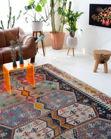 Vintage kilim rug in room decor setting, old rug, antique rug, pastel colors, faded colors, Turkish rug, vintage rug, soft rug, Portland, Oregon, rug store, rug shop, local shop, bold colors, bright colors, faded colors