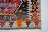 Vintage kilim rug in room decor setting, old rug, antique rug, pastel colors, faded colors, Turkish rug, vintage rug, soft rug, Portland, Oregon, rug store, rug shop, local shop, bold colors, bright colors, faded colors