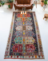 Vintage kilim rug in room decor setting, old rug, antique rug, pastel colors, faded colors, Turkish rug, vintage rug, soft rug, Portland, Oregon, rug store, rug shop, local shop, bold colors, bright colors, faded colors