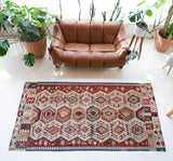 Vintage kilim rug in living room setting, old rug, antique rug, pastel colors, faded colors, Turkish rug, vintage rug, soft rug, Portland, Oregon, rug store, rug shop, local shop, earthy tones, earthy colors, warm colors