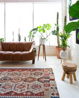 Vintage kilim rug in living room setting, old rug, antique rug, pastel colors, faded colors, Turkish rug, vintage rug, soft rug, Portland, Oregon, rug store, rug shop, local shop, earthy tones, earthy colors, warm colors