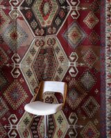 Vintage kilim rug in room decor setting, old rug, antique rug, pastel colors, faded colors, Turkish rug, vintage rug, soft rug, Portland, Oregon, rug store, rug shop, local shop, bold colors, bright colors, faded colors