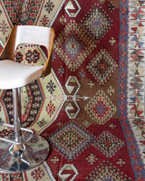 Vintage kilim rug in room decor setting, old rug, antique rug, pastel colors, faded colors, Turkish rug, vintage rug, soft rug, Portland, Oregon, rug store, rug shop, local shop, bold colors, bright colors, faded colors