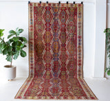 Vintage kilim rug in room decor setting, old rug, antique rug, pastel colors, faded colors, Turkish rug, vintage rug, soft rug, Portland, Oregon, rug store, rug shop, local shop, bold colors, bright colors, faded colors