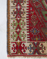 Vintage kilim rug in room decor setting, old rug, antique rug, pastel colors, faded colors, Turkish rug, vintage rug, soft rug, Portland, Oregon, rug store, rug shop, local shop, bold colors, bright colors, faded colors