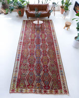 Vintage kilim rug in room decor setting, old rug, antique rug, pastel colors, faded colors, Turkish rug, vintage rug, soft rug, Portland, Oregon, rug store, rug shop, local shop, bold colors, bright colors, faded colors