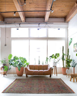 Vintage kilim rug in room decor setting, old rug, antique rug, pastel colors, faded colors, Turkish rug, vintage rug, soft rug, Portland, Oregon, rug store, rug shop, local shop, bold colors, bright colors, faded colors