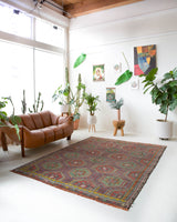 Vintage kilim rug in room decor setting, old rug, antique rug, pastel colors, faded colors, Turkish rug, vintage rug, soft rug, Portland, Oregon, rug store, rug shop, local shop, bold colors, bright colors, faded colors