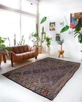 Vintage kilim rug in room decor setting, old rug, antique rug, pastel colors, faded colors, Turkish rug, vintage rug, soft rug, Portland, Oregon, rug store, rug shop, local shop, bold colors, bright colors, faded colors