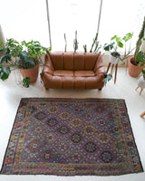 Vintage kilim rug in room decor setting, old rug, antique rug, pastel colors, faded colors, Turkish rug, vintage rug, soft rug, Portland, Oregon, rug store, rug shop, local shop, bold colors, bright colors, faded colors