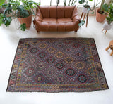 Vintage kilim rug in room decor setting, old rug, antique rug, pastel colors, faded colors, Turkish rug, vintage rug, soft rug, Portland, Oregon, rug store, rug shop, local shop, bold colors, bright colors, faded colors