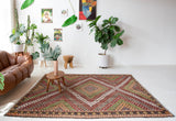 Vintage kilim rug in room decor setting, old rug, antique rug, pastel colors, faded colors, Turkish rug, vintage rug, soft rug, Portland, Oregon, rug store, rug shop, local shop, bold colors, bright colors, faded colors
