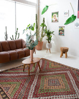 Vintage kilim rug in room decor setting, old rug, antique rug, pastel colors, faded colors, Turkish rug, vintage rug, soft rug, Portland, Oregon, rug store, rug shop, local shop, bold colors, bright colors, faded colors