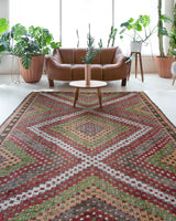 Vintage kilim rug in room decor setting, old rug, antique rug, pastel colors, faded colors, Turkish rug, vintage rug, soft rug, Portland, Oregon, rug store, rug shop, local shop, bold colors, bright colors, faded colors