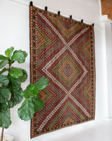 Vintage kilim rug in room decor setting, old rug, antique rug, pastel colors, faded colors, Turkish rug, vintage rug, soft rug, Portland, Oregon, rug store, rug shop, local shop, bold colors, bright colors, faded colors