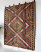 Vintage kilim rug in room decor setting, old rug, antique rug, pastel colors, faded colors, Turkish rug, vintage rug, soft rug, Portland, Oregon, rug store, rug shop, local shop, bold colors, bright colors, faded colors