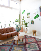 Vintage kilim rug in living room setting, old rug, antique rug, pastel colors, faded colors, Turkish rug, vintage rug, soft rug, Portland, Oregon, rug store, rug shop, local shop, earthy tones, earthy colors, warm colors