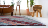 Vintage kilim rug in living room setting, old rug, antique rug, pastel colors, faded colors, Turkish rug, vintage rug, soft rug, Portland, Oregon, rug store, rug shop, local shop, earthy tones, earthy colors, warm colors
