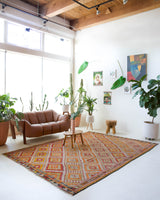 Vintage kilim rug in room decor setting, old rug, antique rug, pastel colors, faded colors, Turkish rug, vintage rug, soft rug, Portland, Oregon, rug store, rug shop, local shop, bold colors, bright colors, faded colors