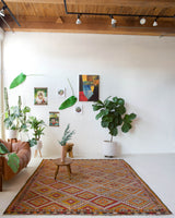 Vintage kilim rug in room decor setting, old rug, antique rug, pastel colors, faded colors, Turkish rug, vintage rug, soft rug, Portland, Oregon, rug store, rug shop, local shop, bold colors, bright colors, faded colors