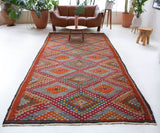 Vintage kilim rug in living room setting, bright colors, wild shaman, soft rug, bold color, Portland, Oregon, rug store, rug shop, local shop, vintage rug, modern kilim, warm colors