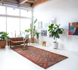 Vintage kilim rug in living room setting, bright colors, wild shaman, soft rug, bold color, Portland, Oregon, rug store, rug shop, local shop, vintage rug, modern kilim, warm colors