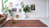Vintage kilim rug in living room setting, bright colors, wild shaman, soft rug, bold color, Portland, Oregon, rug store, rug shop, local shop, vintage rug, modern kilim, warm colors