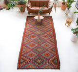 Vintage kilim rug in living room setting, bright colors, wild shaman, soft rug, bold color, Portland, Oregon, rug store, rug shop, local shop, vintage rug, modern kilim, warm colors