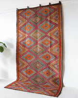 Vintage kilim rug in living room setting, bright colors, wild shaman, soft rug, bold color, Portland, Oregon, rug store, rug shop, local shop, vintage rug, modern kilim, warm colors