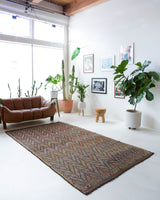 Vintage kilim rug in room decor setting, old rug, antique rug, pastel colors, faded colors, Turkish rug, vintage rug, soft rug, Portland, Oregon, rug store, rug shop, local shop, bold colors, bright colors, faded colors