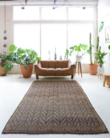 Vintage kilim rug in room decor setting, old rug, antique rug, pastel colors, faded colors, Turkish rug, vintage rug, soft rug, Portland, Oregon, rug store, rug shop, local shop, bold colors, bright colors, faded colors