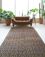 Vintage kilim rug in room decor setting, old rug, antique rug, pastel colors, faded colors, Turkish rug, vintage rug, soft rug, Portland, Oregon, rug store, rug shop, local shop, bold colors, bright colors, faded colors