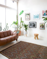 Vintage kilim rug in room decor setting, old rug, antique rug, pastel colors, faded colors, Turkish rug, vintage rug, soft rug, Portland, Oregon, rug store, rug shop, local shop, bold colors, bright colors, faded colors