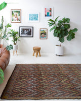 Vintage kilim rug in room decor setting, old rug, antique rug, pastel colors, faded colors, Turkish rug, vintage rug, soft rug, Portland, Oregon, rug store, rug shop, local shop, bold colors, bright colors, faded colors