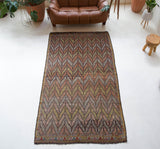 Vintage kilim rug in room decor setting, old rug, antique rug, pastel colors, faded colors, Turkish rug, vintage rug, soft rug, Portland, Oregon, rug store, rug shop, local shop, bold colors, bright colors, faded colors