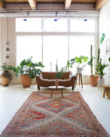 Vintage kilim rug in living room setting, old rug, antique rug, pastel colors, faded colors, Turkish rug, vintage rug, soft rug, Portland, Oregon, rug store, rug shop, local shop, earthy tones, earthy colors, warm colors