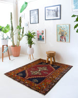 Vintage Turkish rug in a living room setting, pile rug, Turkish rug, vintage rug, portland, rug shop, bright colors, wild shaman, soft rug, bold color, Portland, Oregon, rug store, rug shop, local shop, antique rug