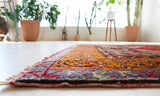 Vintage Turkish rug in a living room setting, pile rug, Turkish rug, vintage rug, portland, rug shop, bright colors, wild shaman, soft rug, bold color, Portland, Oregon, rug store, rug shop, local shop, antique rug