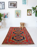 Vintage caucasian rug in a living room setting, pile rug, Turkish rug, vintage rug, portland, rug shop, bright colors, wild shaman, soft rug, bold color, Portland, Oregon, rug store, rug shop, local shop, soft rug, pastel colors, faded colors