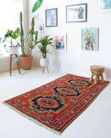 Vintage caucasian rug in a living room setting, pile rug, Turkish rug, vintage rug, portland, rug shop, bright colors, wild shaman, soft rug, bold color, Portland, Oregon, rug store, rug shop, local shop, soft rug, pastel colors, faded colors