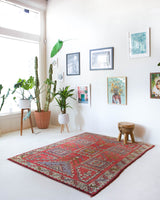 Vintage Turkish rug in living room setting, old rug, antique rug, pastel colors, faded colors, Turkish rug, vintage rug, soft rug, Portland, Oregon, rug store, rug shop, local shop