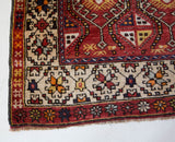 Vintage Turkish runner rug in living room setting, old rug, antique rug, pastel colors, faded colors, Turkish rug, vintage rug, soft rug, Portland, Oregon, rug store, rug shop, local shop