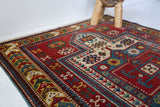 Vintage Turkish rug in living room setting, old rug, antique rug, pastel colors, faded colors, Turkish rug, vintage rug, soft rug, Portland, Oregon, rug store, rug shop, local shop