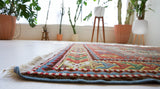 Vintage Turkish rug in living room setting, old rug, antique rug, pastel colors, faded colors, Turkish rug, vintage rug, soft rug, Portland, Oregon, rug store, rug shop, local shop