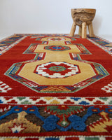 Vintage Turkish rug in a living room setting, pile rug, Turkish rug, vintage rug, portland, rug shop, bright colors, wild shaman, soft rug, bold color, Portland, Oregon, rug store, rug shop, local shop, antique rug