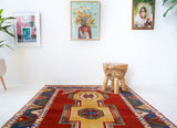 Vintage Turkish rug in a living room setting, pile rug, Turkish rug, vintage rug, portland, rug shop, bright colors, wild shaman, soft rug, bold color, Portland, Oregon, rug store, rug shop, local shop, antique rug