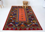 Vintage Turkish rug in a living room setting, pile rug, Turkish rug, vintage rug, portland, rug shop, bright colors, wild shaman, soft rug, bold color, Portland, Oregon, rug store, rug shop, local shop, antique rug
