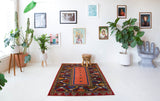 Vintage Turkish rug in a living room setting, pile rug, Turkish rug, vintage rug, portland, rug shop, bright colors, wild shaman, soft rug, bold color, Portland, Oregon, rug store, rug shop, local shop, antique rug